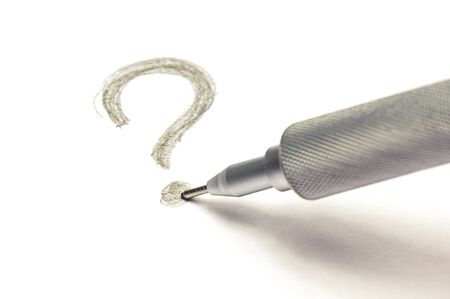 Part of professional  precise metal automatic pencil and question mark on white background. A pencil stylus is mounted on the point of a question mark. The concept of choosing a way out of the crisis.の写真素材