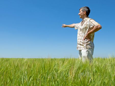 man in the field of wheatの写真素材