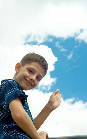 a pleased boy at the skiesの写真素材