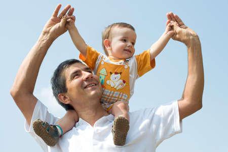 father and his little son are playing outdoorの写真素材
