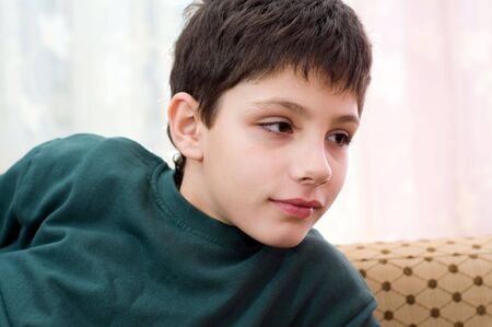 a portrait of a boy in greenの写真素材