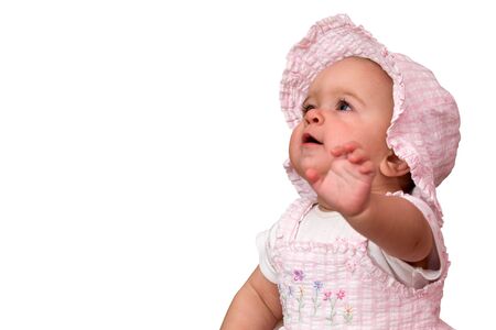a portrait of a baby in pink suit and hatの写真素材