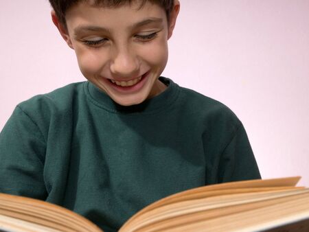a portrait of a boy with a bookの写真素材
