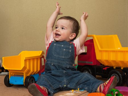 A baby has got his aim while playing toysの写真素材