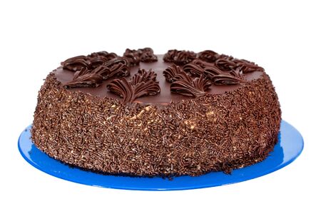 A chocolate cake on the blue plate, isolated on the white backgroundの写真素材