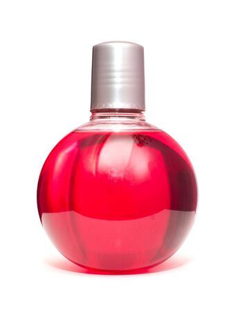One bottle of the red shampoo, isolated on whiteの写真素材