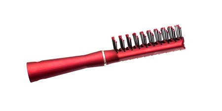 A red comb, isolated on the white backgroundの写真素材