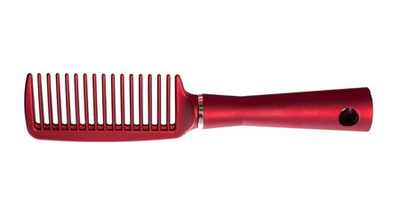 A red comb; isolated on the white backgroundの写真素材