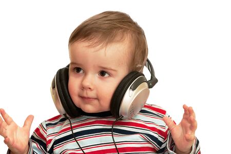A portrait of a kid in striped shirt with headphones; isolated on the white backgroundの写真素材