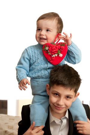 Brothers and a red heart as a symbol of St. Valentine's Dayの写真素材