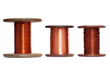 A three rolls of copper wire; isolated on the white backgroundの写真素材