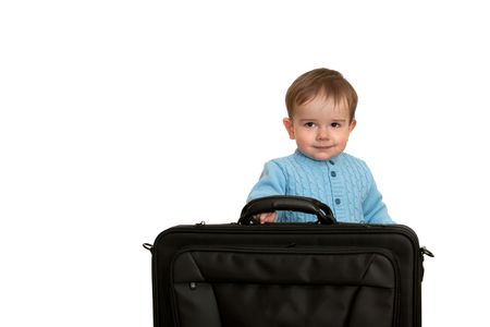 A toddler is taking a big black bag; isolated on the white backgroundの写真素材