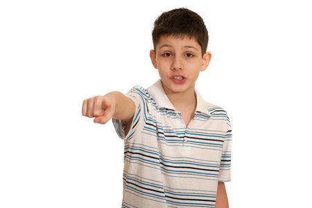 A speaking boy is pointing forward, isolated on the white backgroundの写真素材