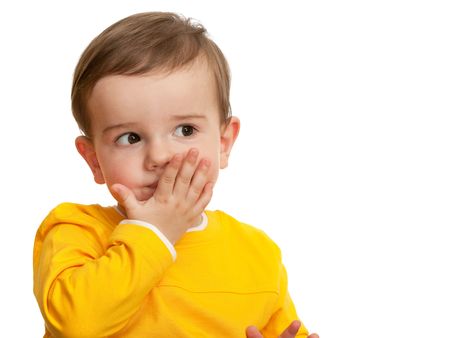 A beautiful toddler is sending a kiss; isolated on the white backgroundの写真素材