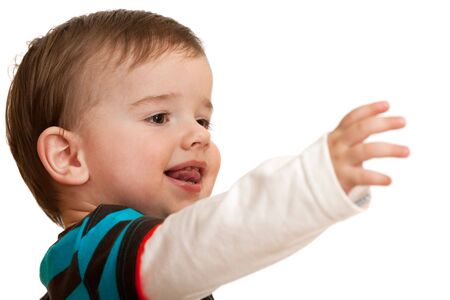 A toddler is stretching forward his hand; isolated on the white backgroundの写真素材