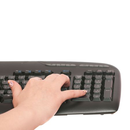 A woman's hand is typing on the pc keyboard の写真素材