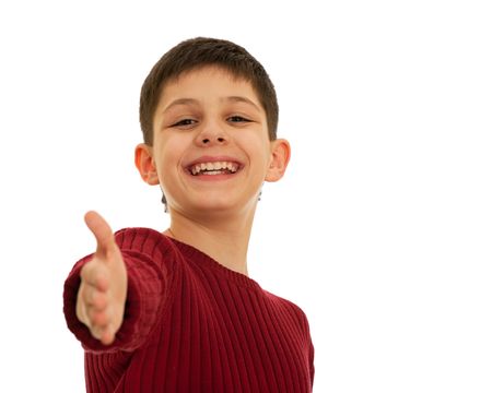 A happy teen is stretching his right hand forward; isolated on the white backgroundの写真素材