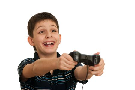 An ardor boy in black shirt is playing a computer game using joystick; isolated on the white backgroundの写真素材