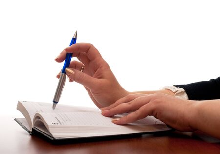 A woman is going to write in her diaryの写真素材