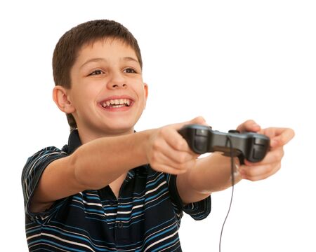 A laughing boy is playing a computer game with joystick; isolated on the white backgroundの写真素材