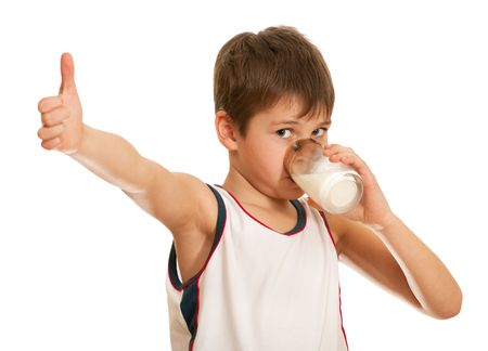 A drinking milk boy is showing his tumb up; isolated on the white background A drinking milk boy is showing his tumb up; isolated on the white background