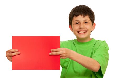 A boy in green is holding a sheet of red paper; isolated on the white backgroundの写真素材