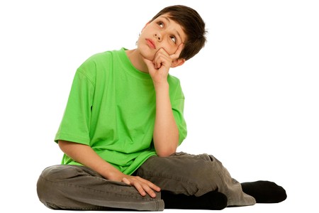 A boy in green is dreaming; isolated on the white backgroundの写真素材