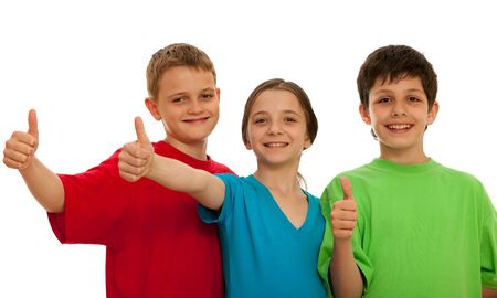 Three happy kids are holding their thumbs up; isolated on the white backgroundの写真素材