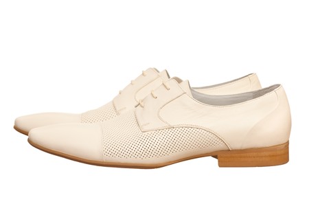 Pair of white fashion men shoes; isolated on the white backgroundの写真素材