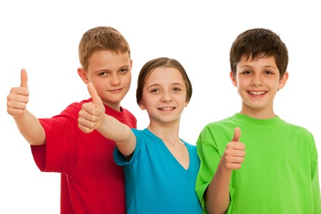 Group of smiling kids are holding their thumbs up; isolated on the white backgroundの写真素材