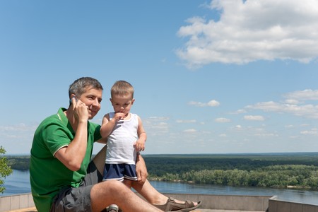 A father and his little son are traveling togetherの写真素材