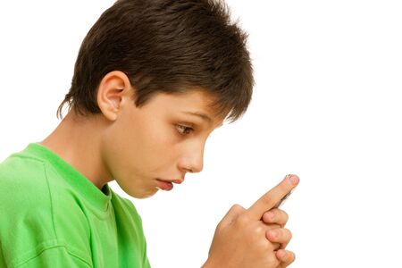 A portrait of a dissatisfied  boy; isolated on the white backgroundの写真素材