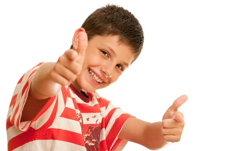 A happy boy is showing thumbs up; isolated on the white backgroundの写真素材