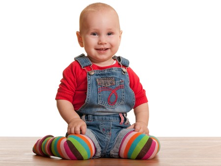 A portrait of a smiling little toddler in casual clothes; isolated on the white backgroundの写真素材