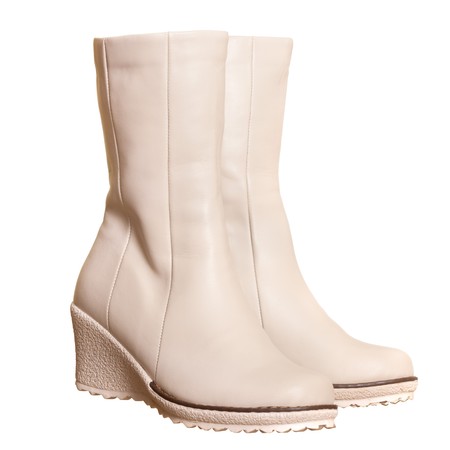 A pair of light beige boots isolated on the white background の写真素材