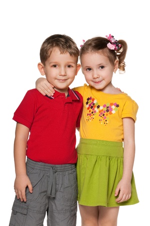 A boy and a girl are standing together; isolated on the white backgroundの写真素材