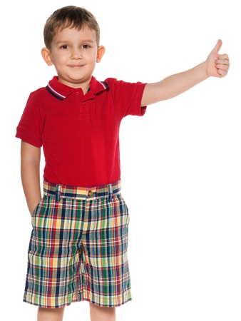 A portrait of a little boy in red holding his thumb up; isolated on the white backgroundの写真素材