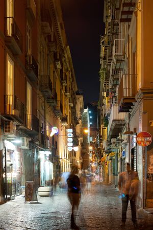NAPLES, ITALY - SEPTEMBER 29: People are walking on the old street of Naples on September 29, 2012 in Naples. Historical center of Naples became a UNESCO World Heritage Site since 1995. GPS information is in the file.のeditorial素材