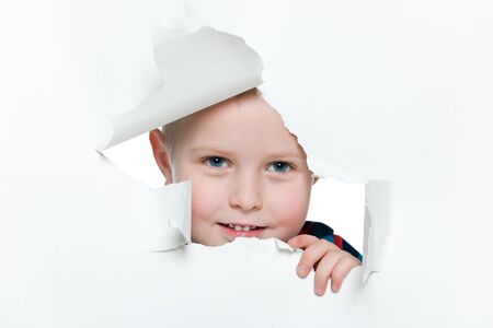 A portrait of a curious young boyの写真素材