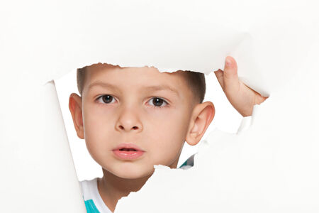 A portrait of a curious small boyの写真素材