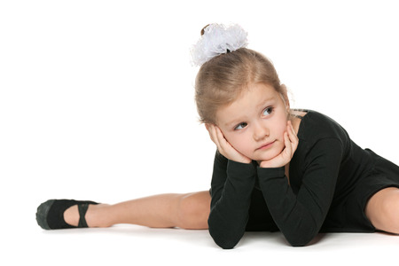 Young ballet dancer is having some rest between training sets の写真素材