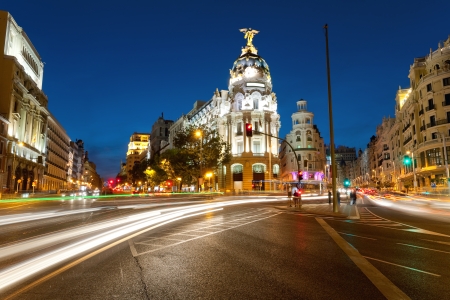 Crossing Alcala and Gran Via street in Madrid by nightの写真素材