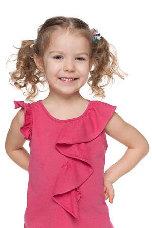 A closeup portrait of a happy little girl against the white backgroundの写真素材