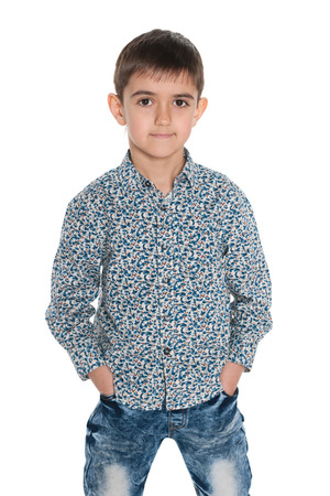 A portrait of a fashion young boy on the white backgroundの写真素材