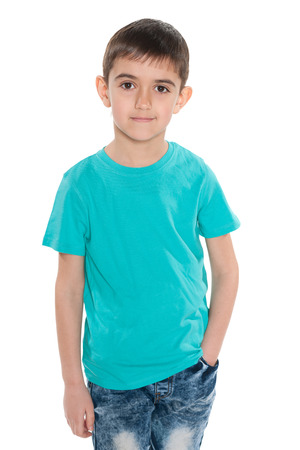 A portrait of a smiling boy in the blue shirt on the white backgroundの写真素材