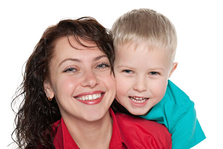 A closeup portrait of a happy mother with her son on the white backgroundの写真素材