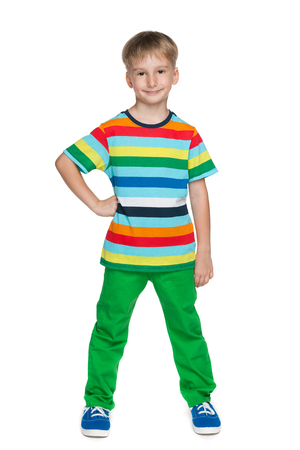 A portrait of a handsome little boy in the stripeed shirt against the white backgroundの写真素材