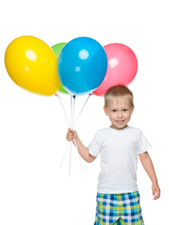 A little happy boy with balloons against the white backgroundの写真素材