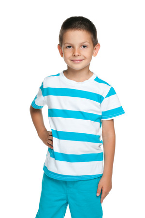 A portrait of a cute young boy in striped blue shirt on the white backgroundの写真素材