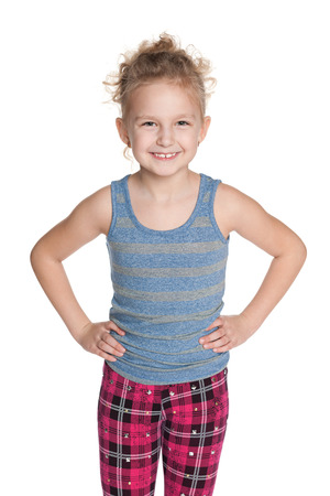 A lovely young girl is standing on the white backgroundの写真素材